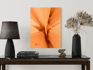 a table topped with a lamp and a vase filled with flowers