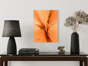 a table with a lamp and a vase with flowers on it