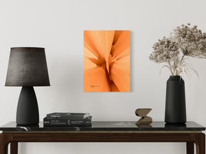 a table with a lamp and a vase with flowers on it