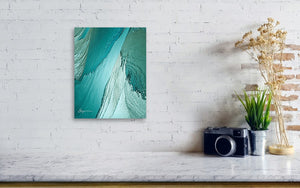 a white brick wall with a painting on it