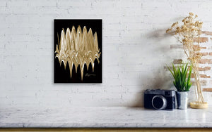 a white brick wall with a black and gold painting on it