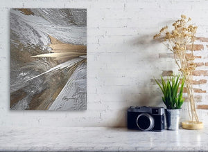 a white brick wall with a painting on it