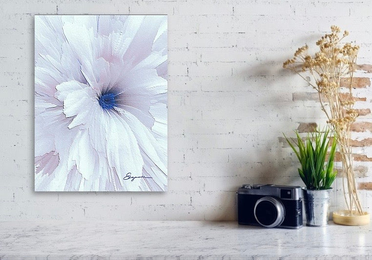 a close up of a white flower with a blue center