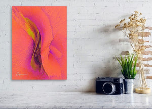 a painting on a brick wall next to a camera