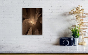 a white brick wall with a black and white photograph on it