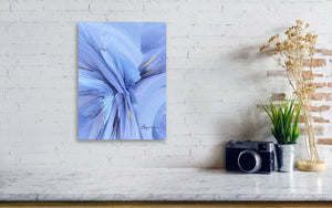 a white brick wall with a blue painting on it