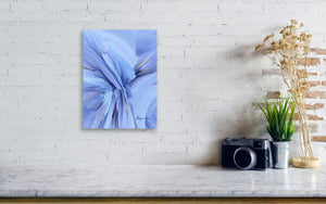 a white brick wall with a blue painting on it